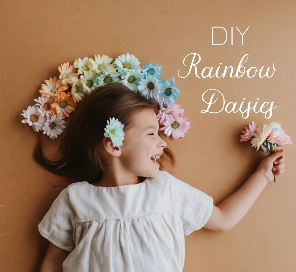 DIY Rainbow Daisies styled as a crown on toddler girl