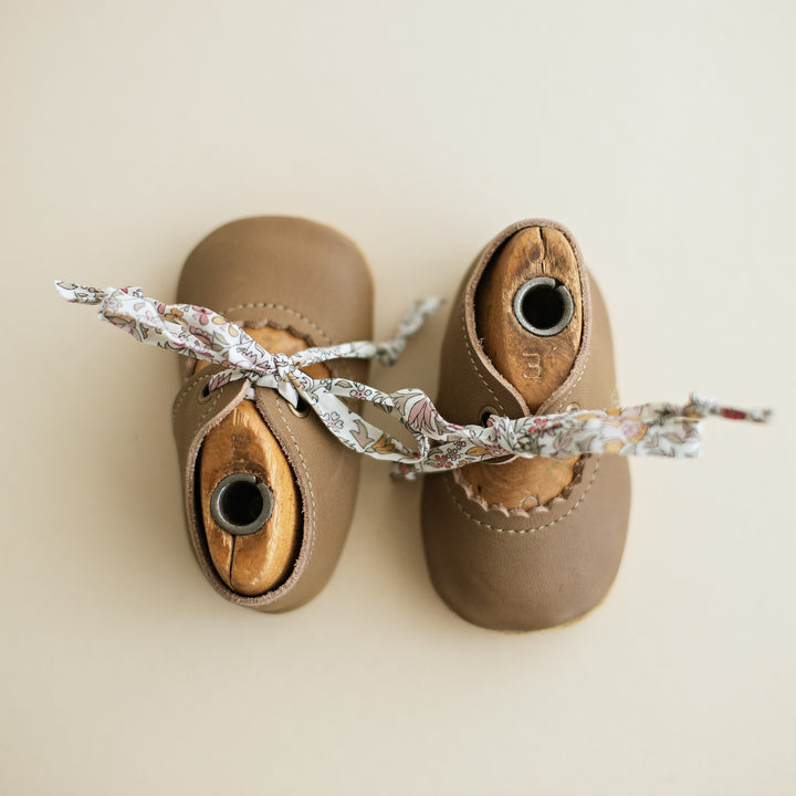 Taupe Leather baby girl tie Mary Janes. Caraclarkdesign Bella Janes for baby girls.