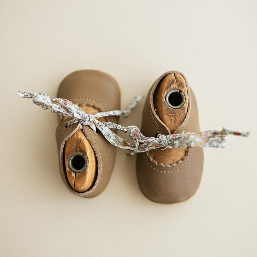 Taupe Leather baby girl tie Mary Janes. Caraclarkdesign Bella Janes for baby girls.