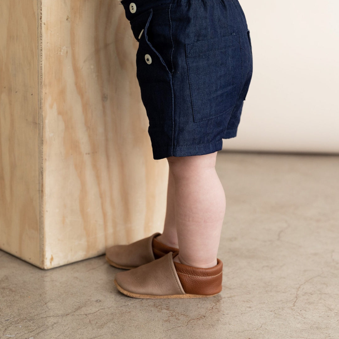 baby boy leather baby shoes in dark brown and gray. Slip on mocc style shown on model