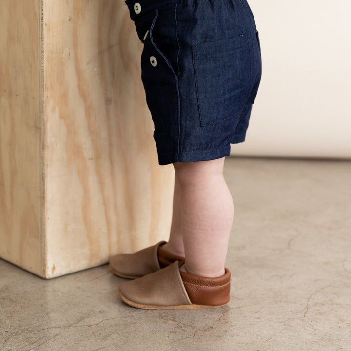 baby boy leather baby shoes in dark brown and gray. Slip on mocc style shown on model